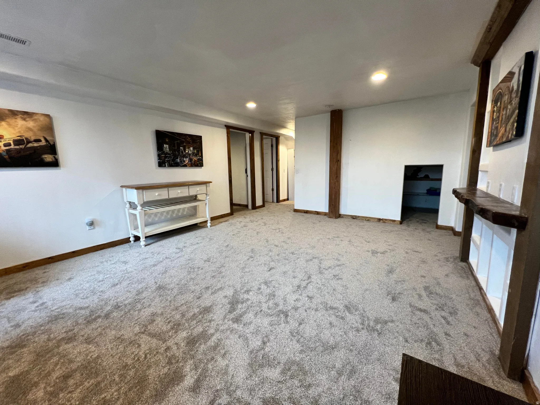 Unfurnished living room featuring recessed lighting and carpet flooring