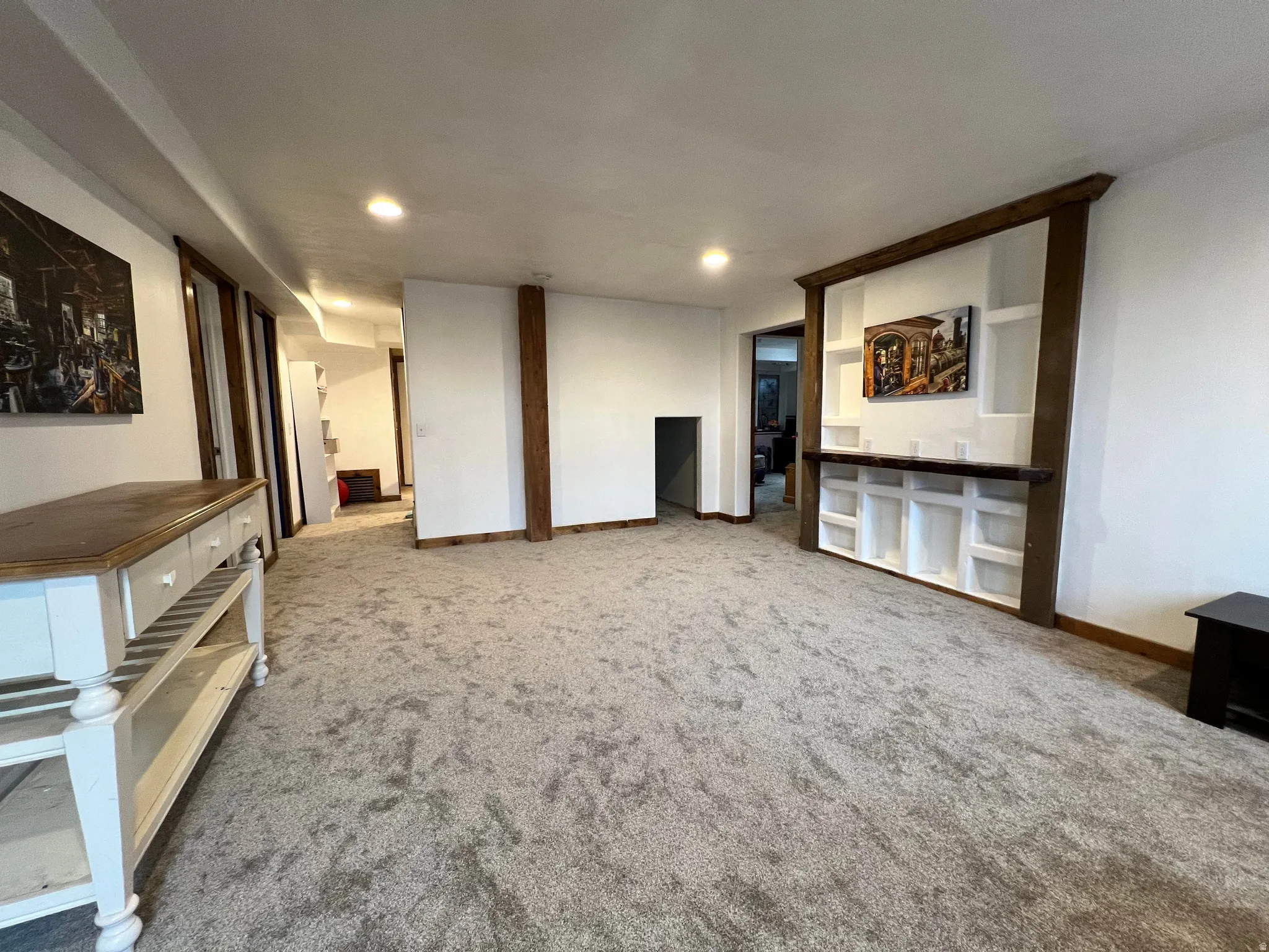 Unfurnished living room with carpet and recessed lighting