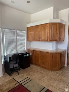 Office area featuring light tile patterned floors