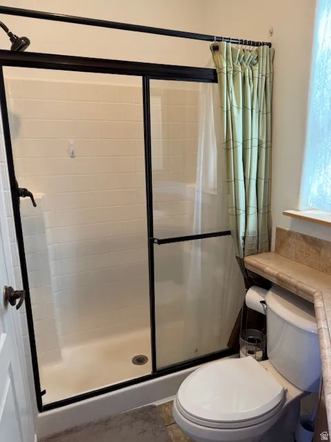Bath featuring a stall shower