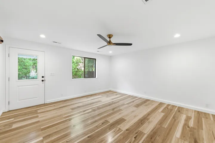 Unfurnished room with light wood finished floors, recessed lighting, and a ceiling fan