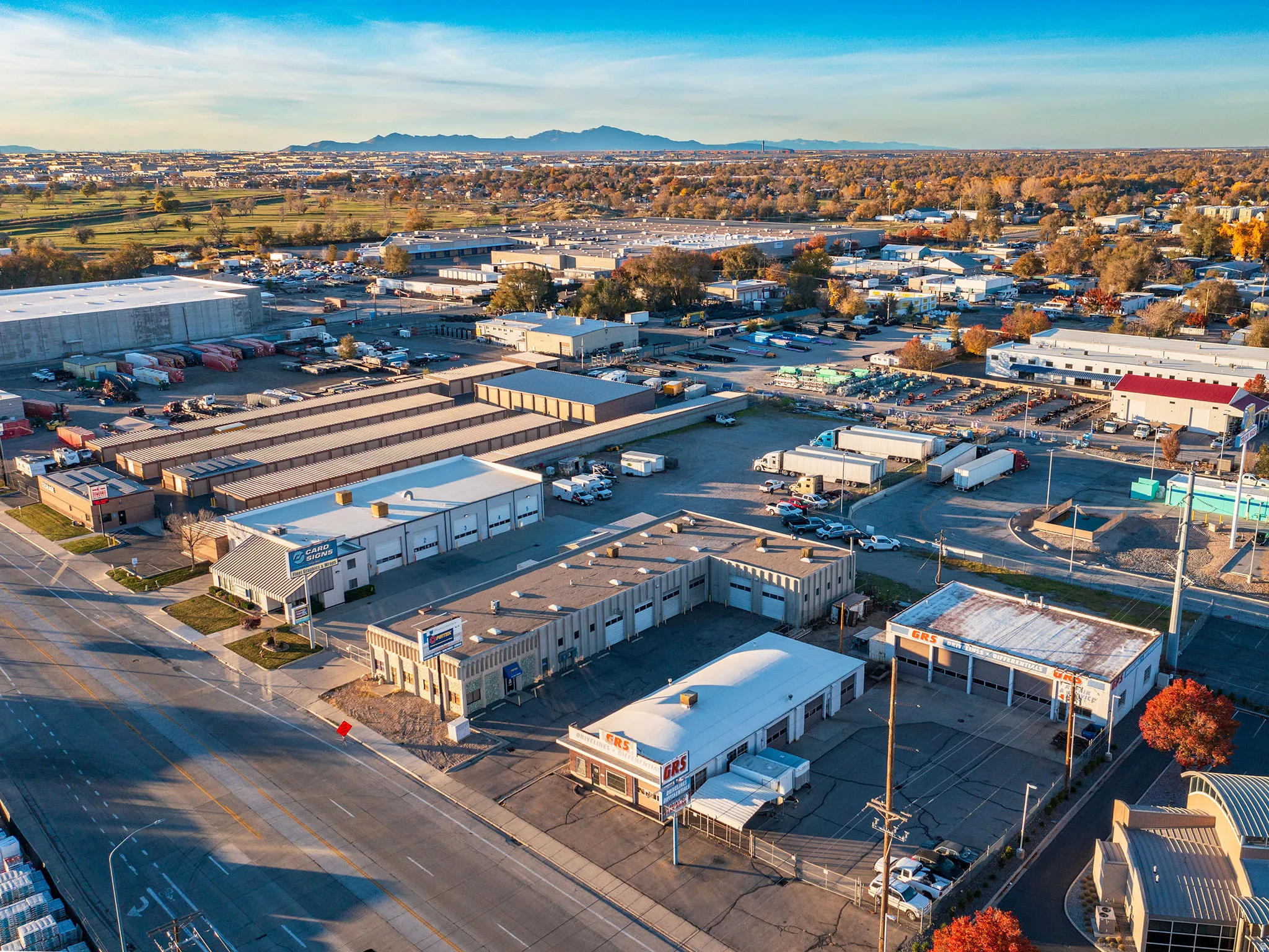 Bird's eye view of industrial structures and mountains