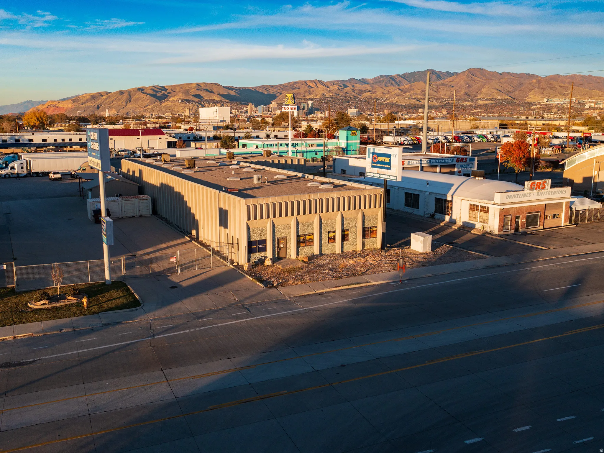 Drone / aerial view of an industrial area and a mountain backdrop