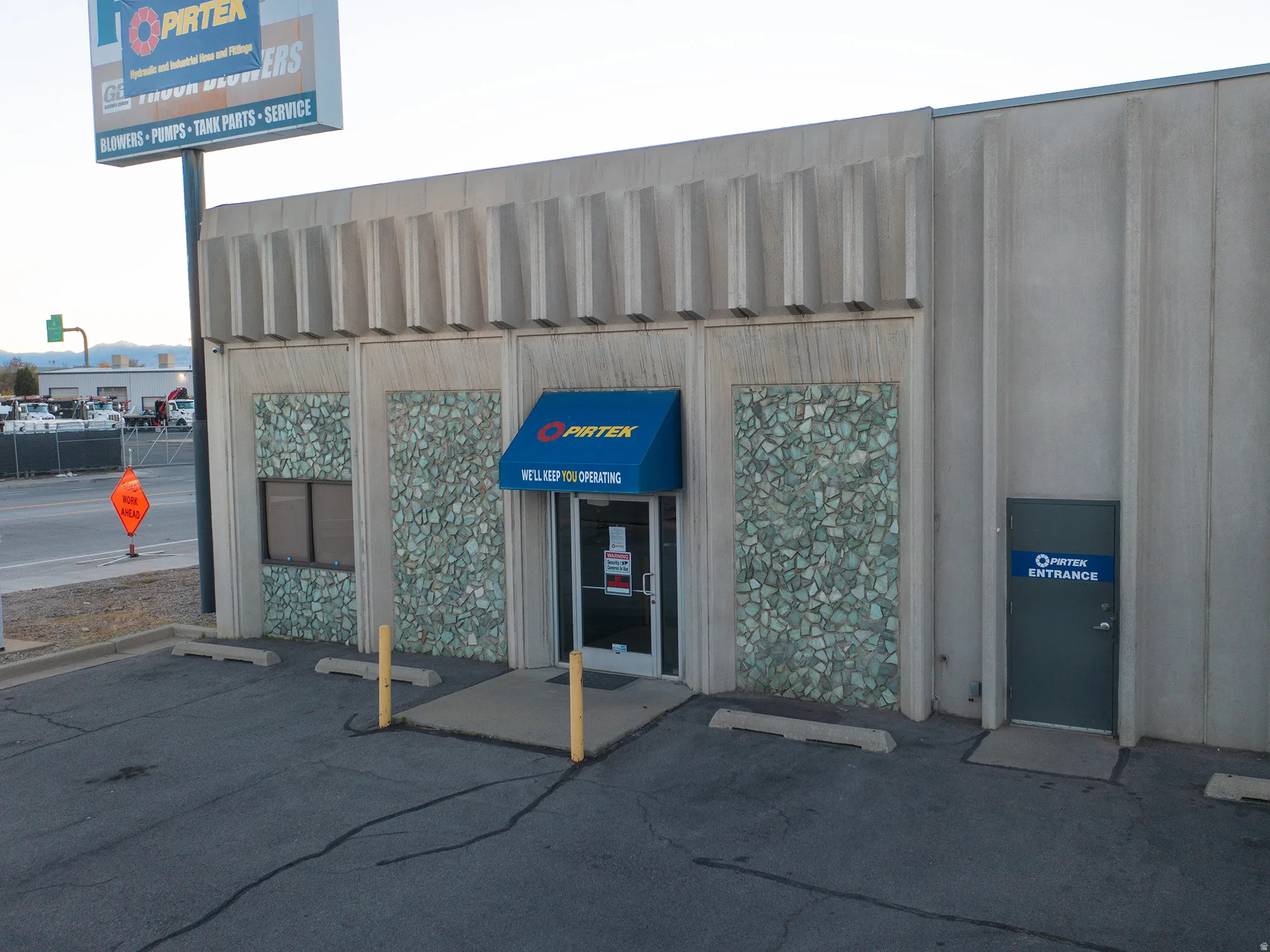 View of property featuring uncovered parking