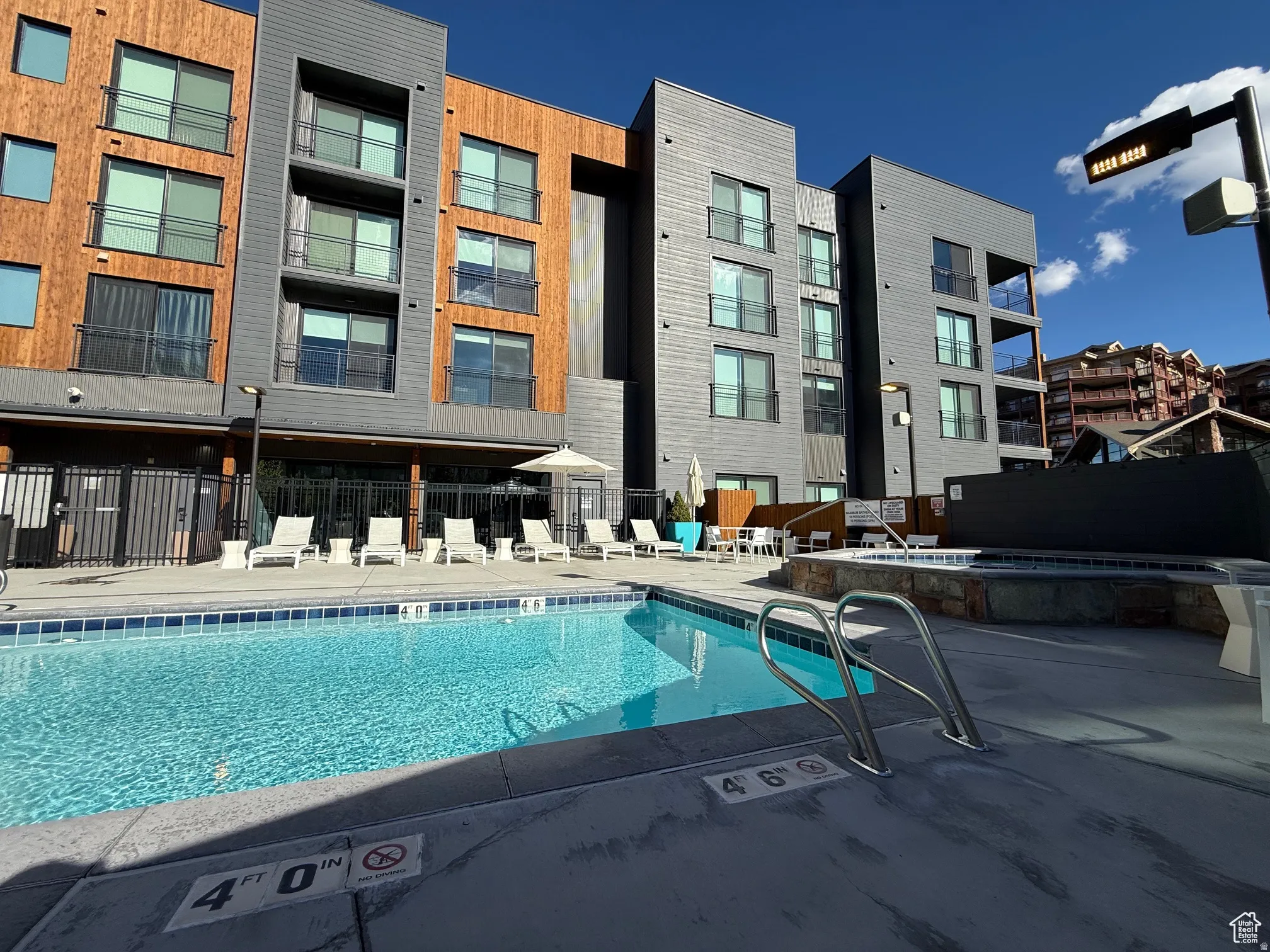 Community pool featuring a community hot tub