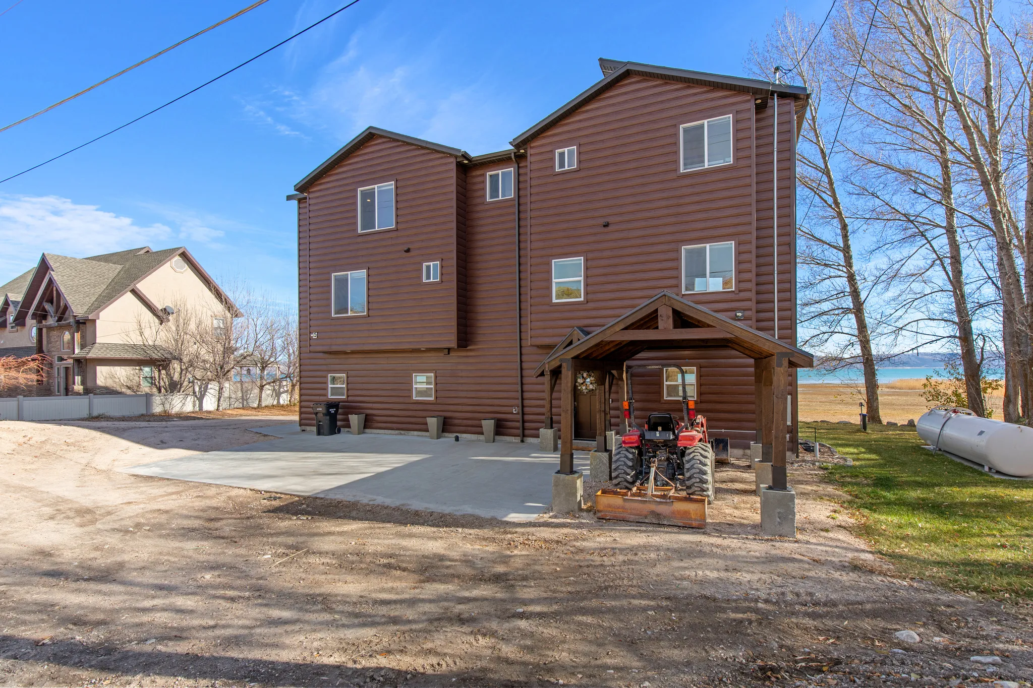 Back of property featuring faux log siding