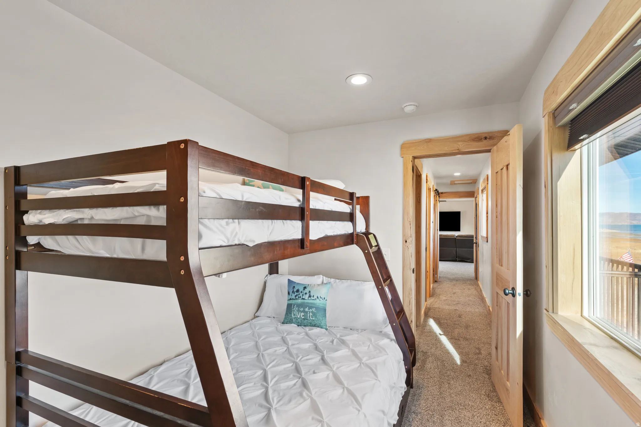 Bedroom with light carpet and recessed lighting