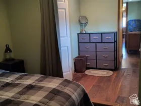 Bedroom featuring dark wood finished floors
