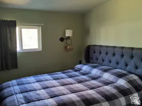 Bedroom featuring a textured ceiling