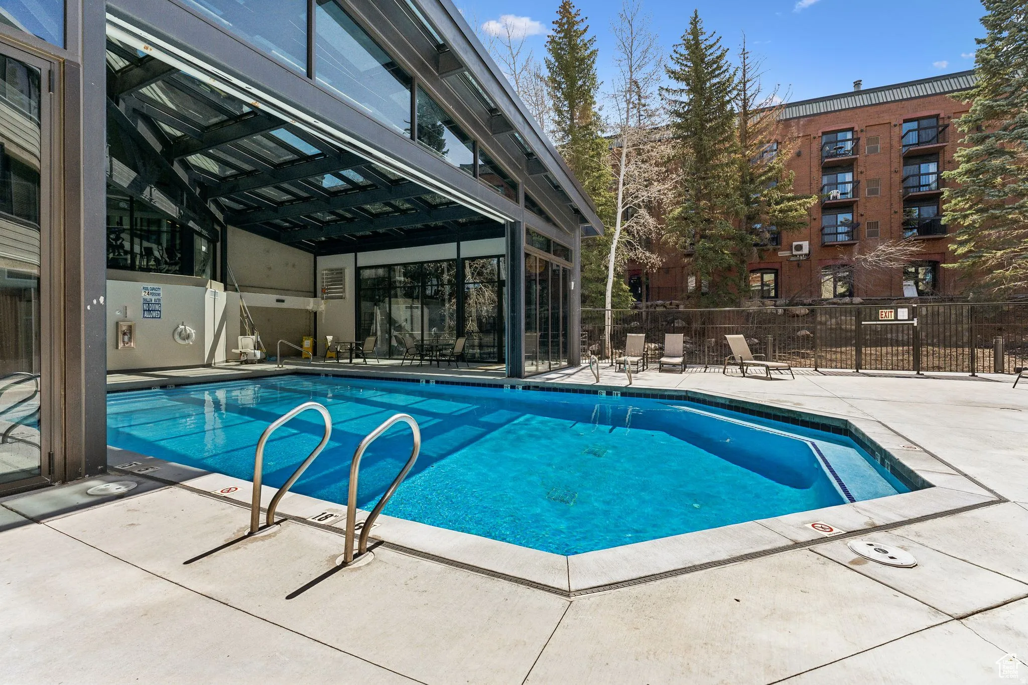 Community pool with a patio area