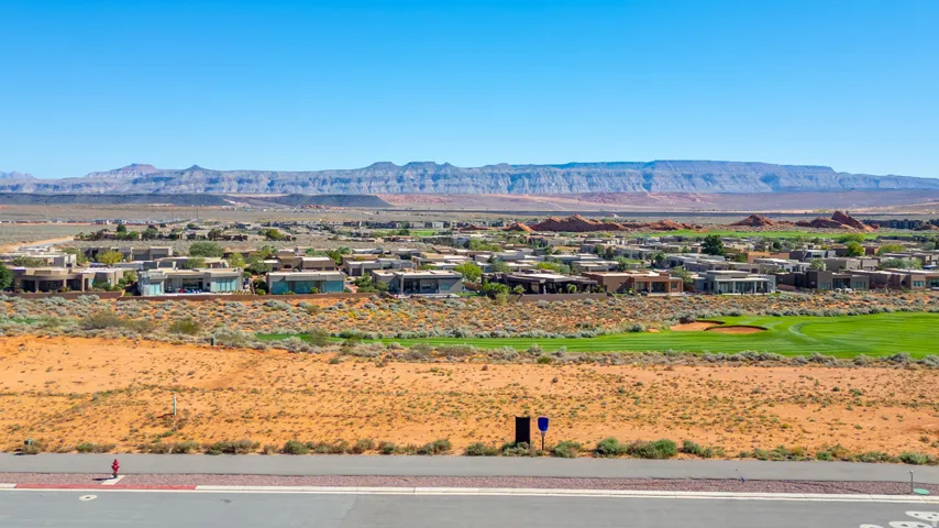View of mountain backdrop featuring nearby suburban area