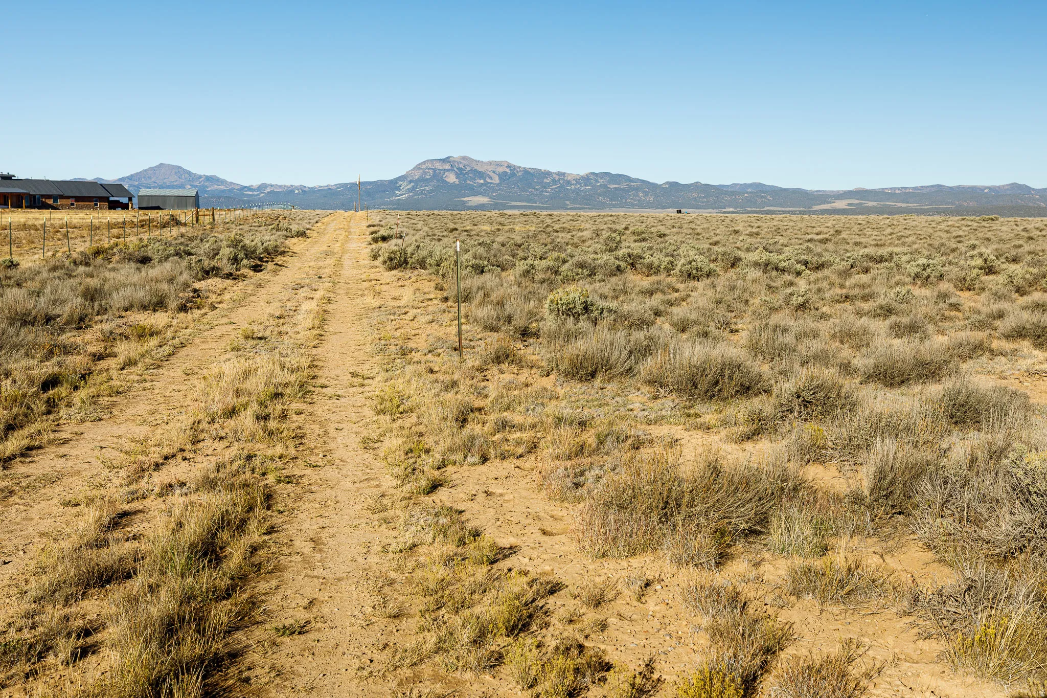 View of mountain background featuring rural landscape