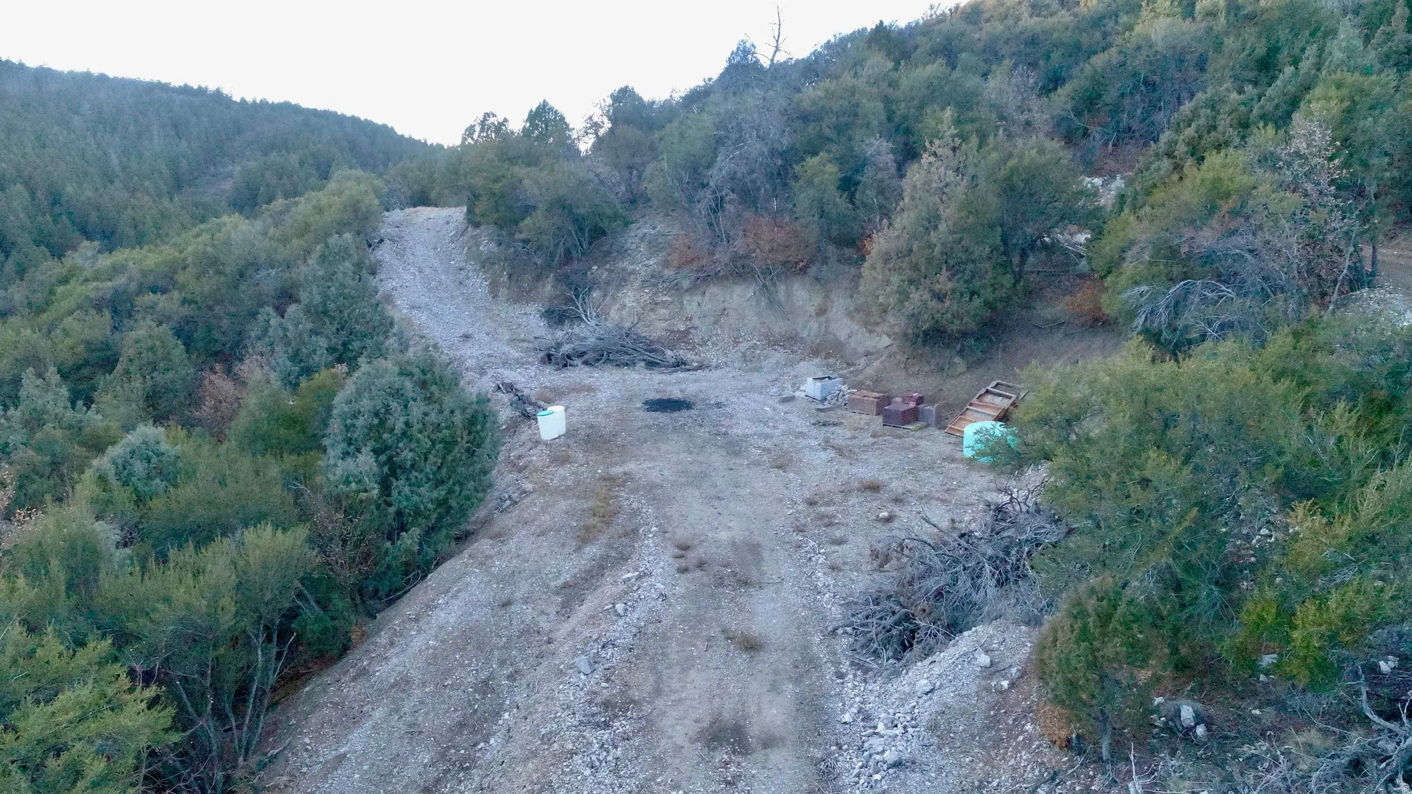 Aerial view of property's location featuring a forest and rural landscape