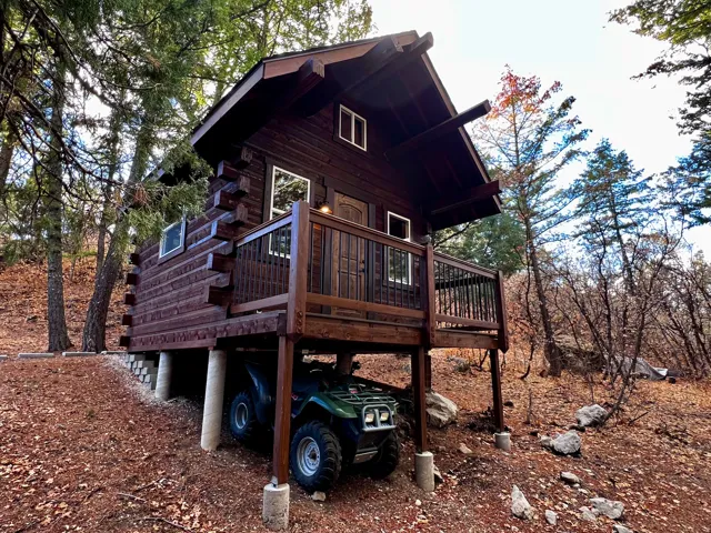 View of side of home with a deck and log exterior