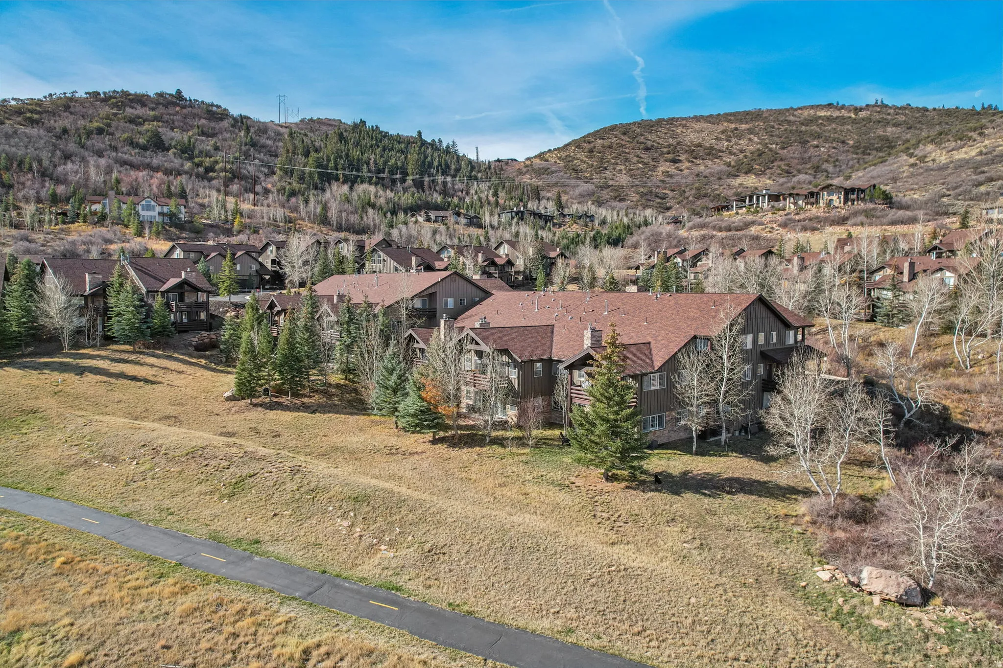 View of mountain backdrop featuring nearby suburban area