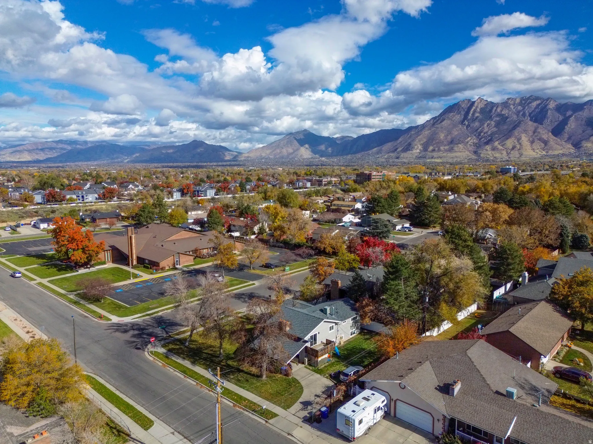 Aerial view of residential area featuring a mountainous background