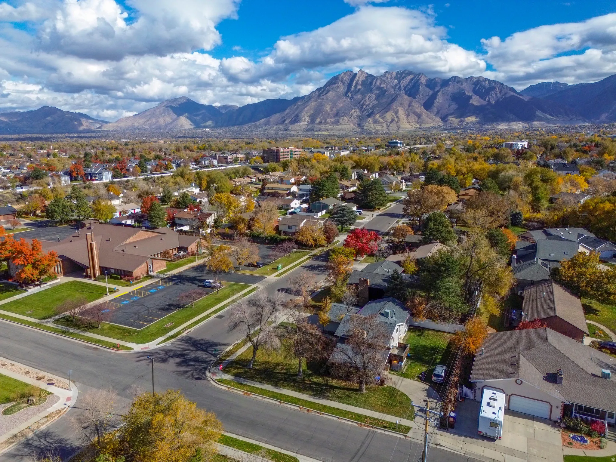 Aerial view of residential area featuring a mountain backdrop