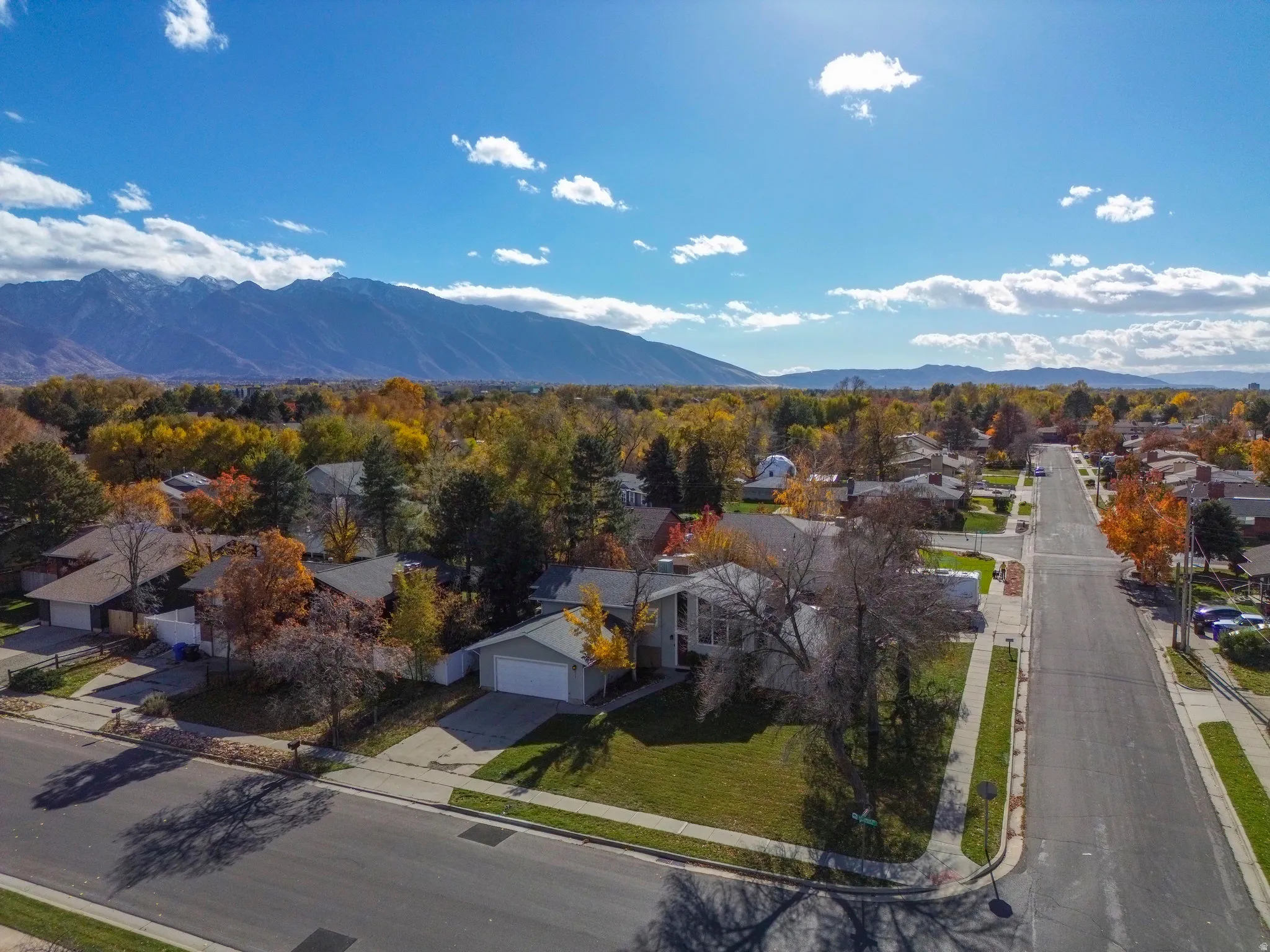 Aerial view of residential area featuring a mountainous background