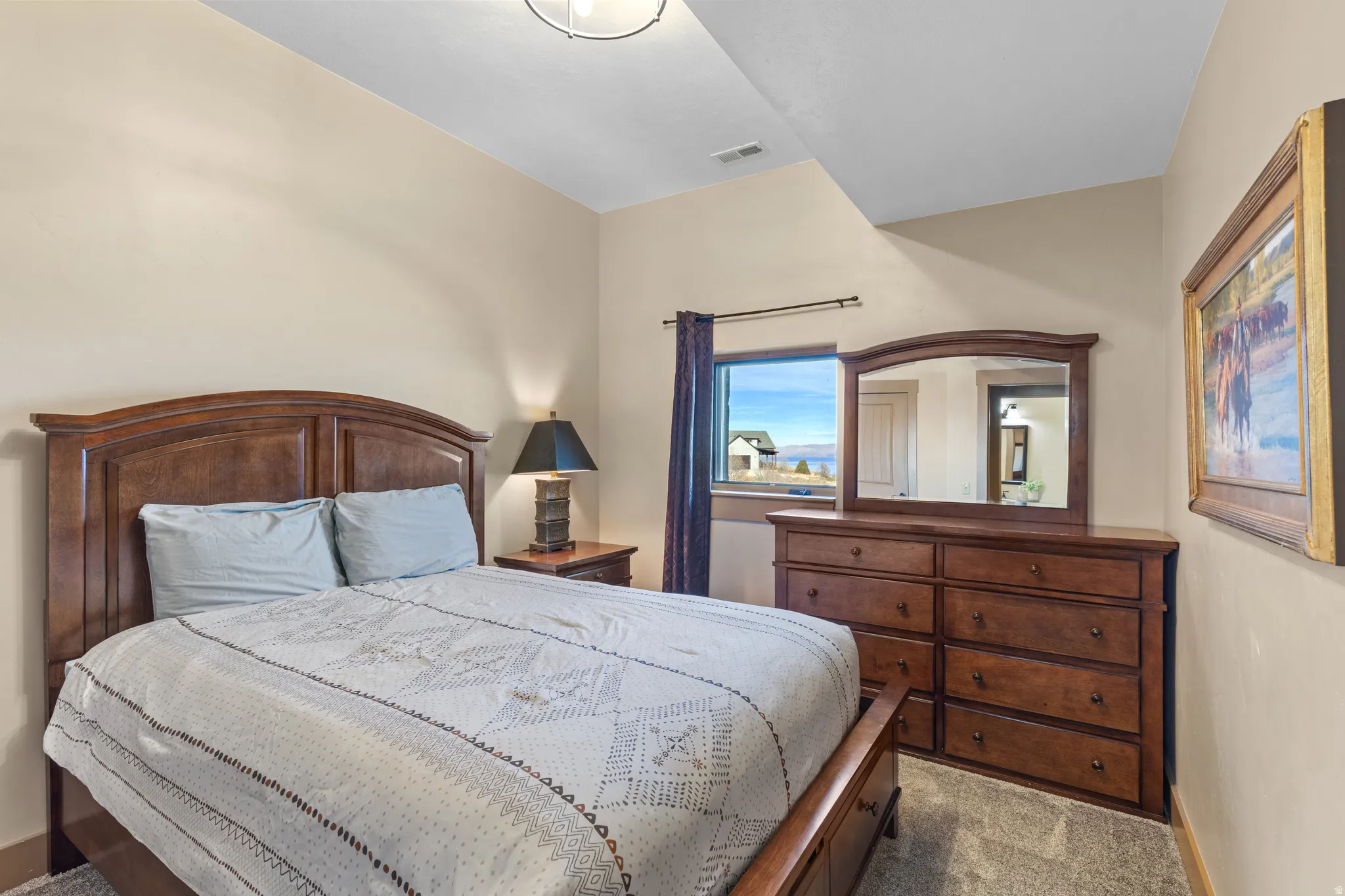 Carpeted bedroom featuring baseboards