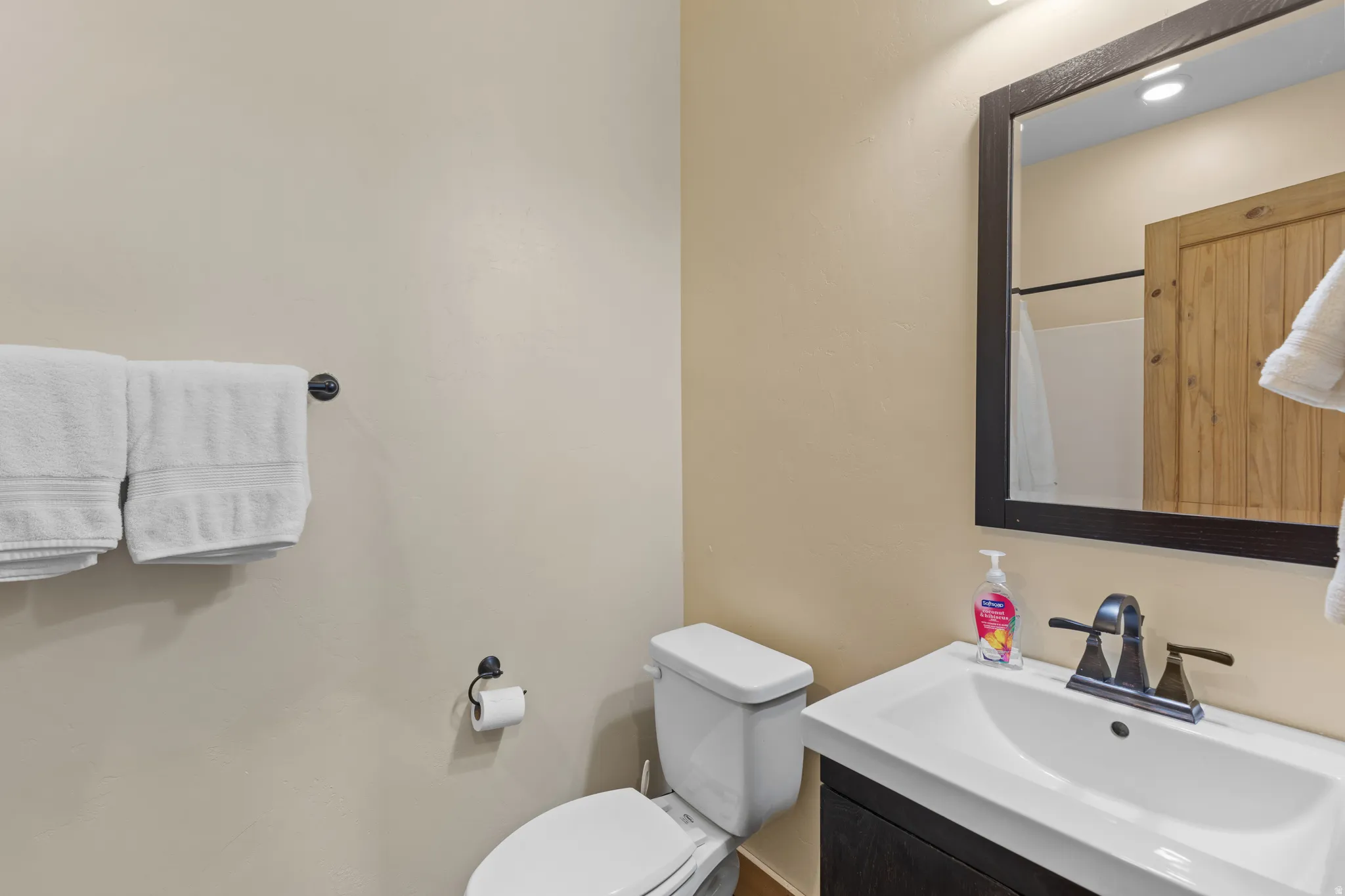 Full bath featuring vanity and a shower with curtain