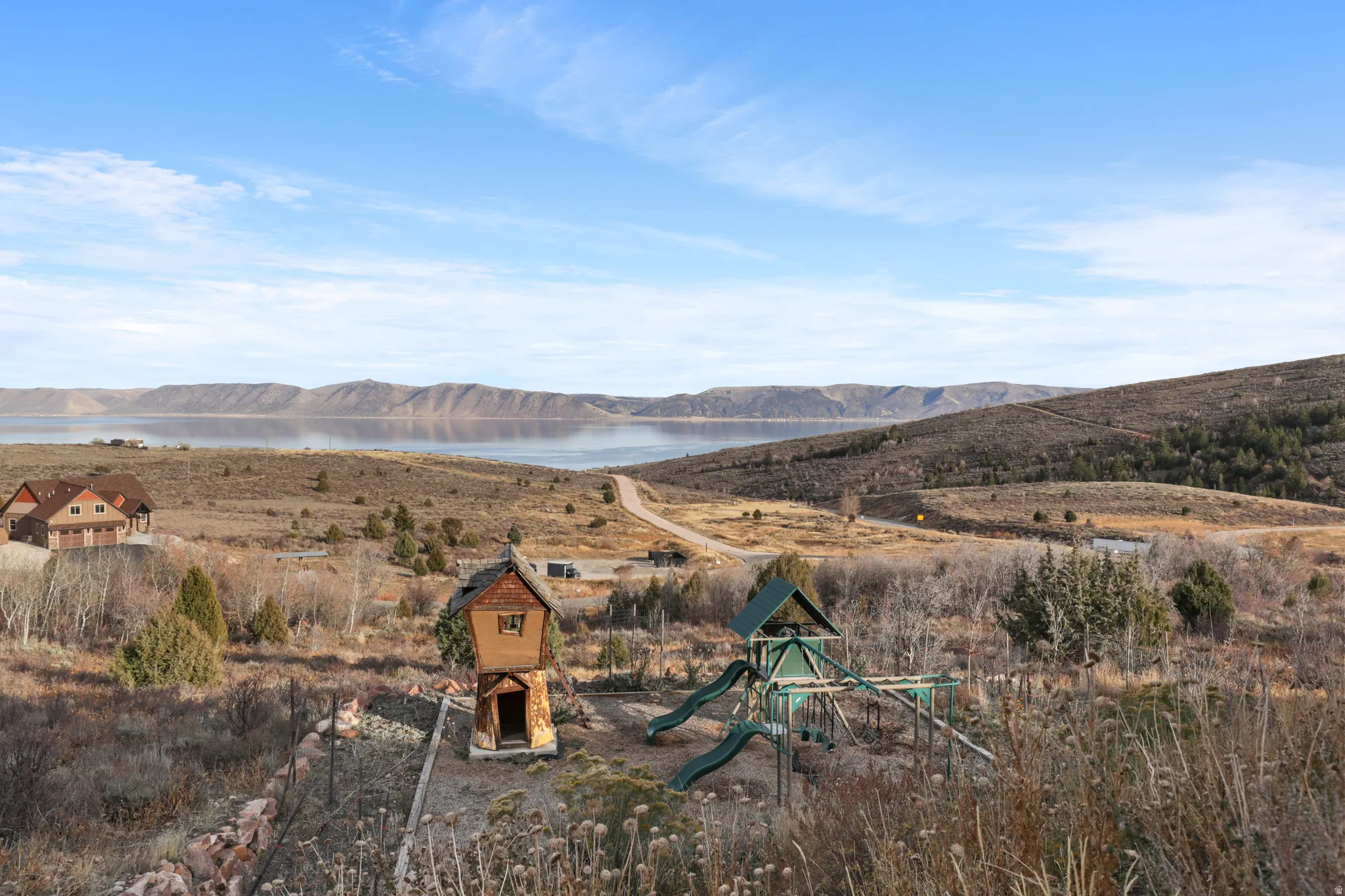 View of mountain backdrop featuring a large body of water
