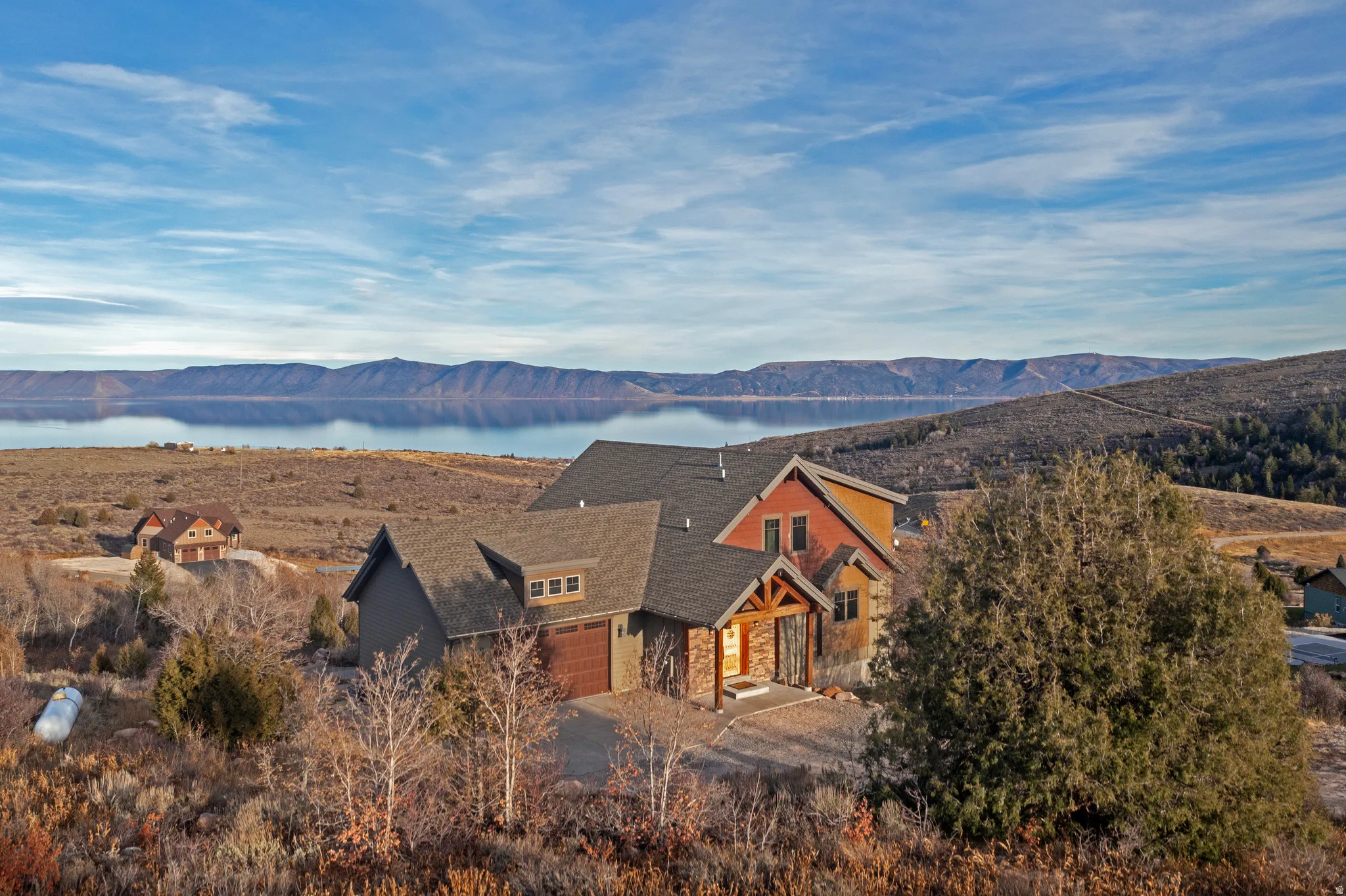 View of mountain backdrop featuring a nearby body of water