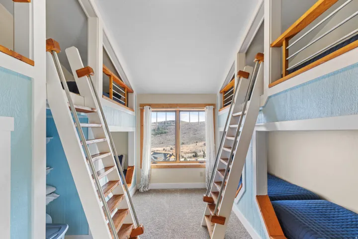 Bedroom with light carpet and baseboards