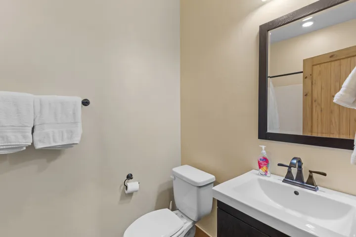Full bath featuring vanity and a shower with curtain