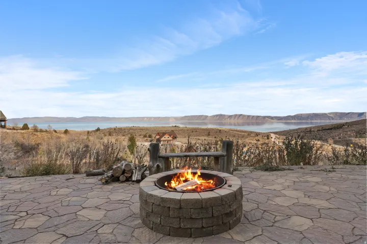 View of patio / terrace with a water and mountain view