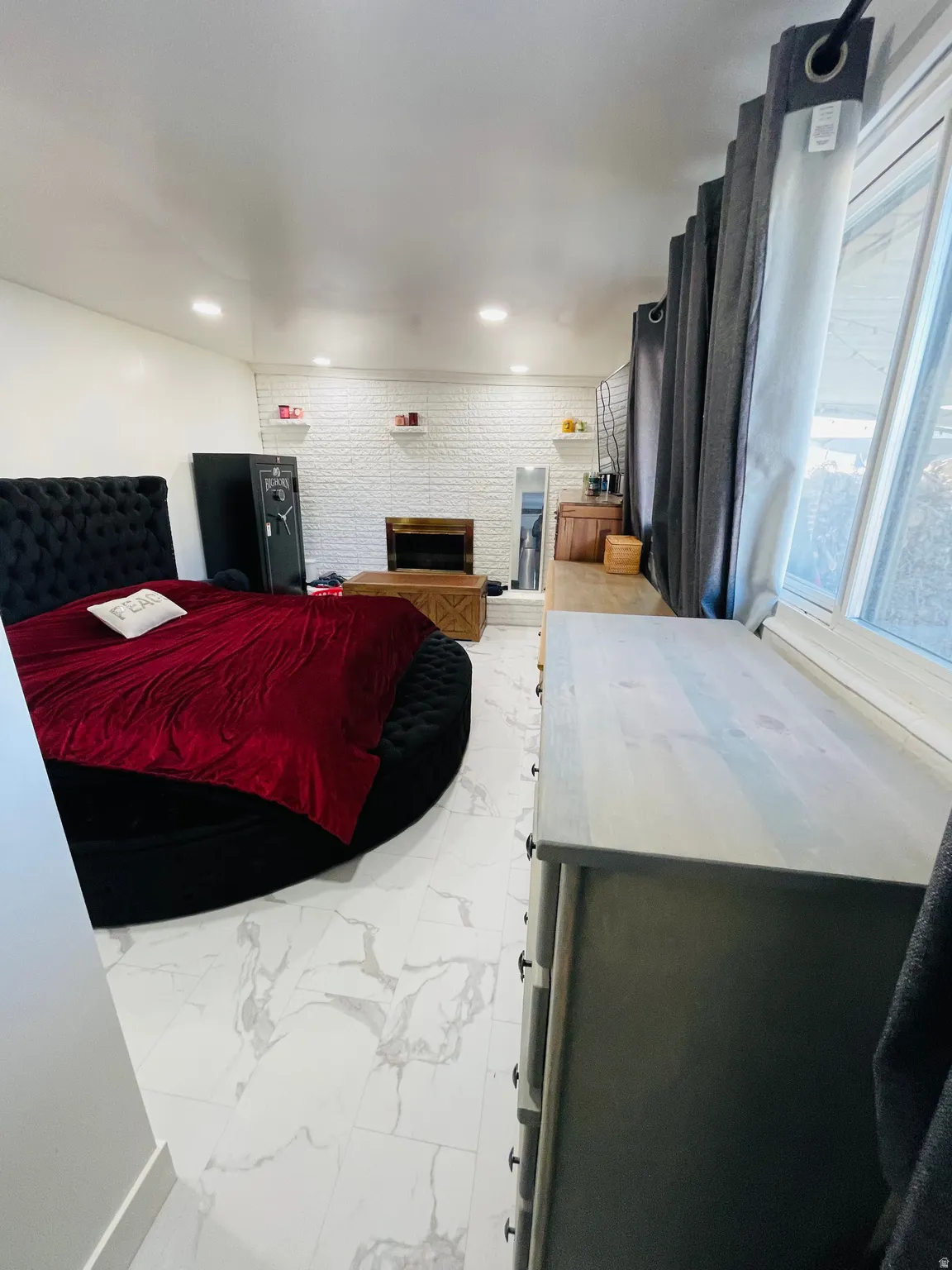 Bedroom with light marble finish flooring and recessed lighting