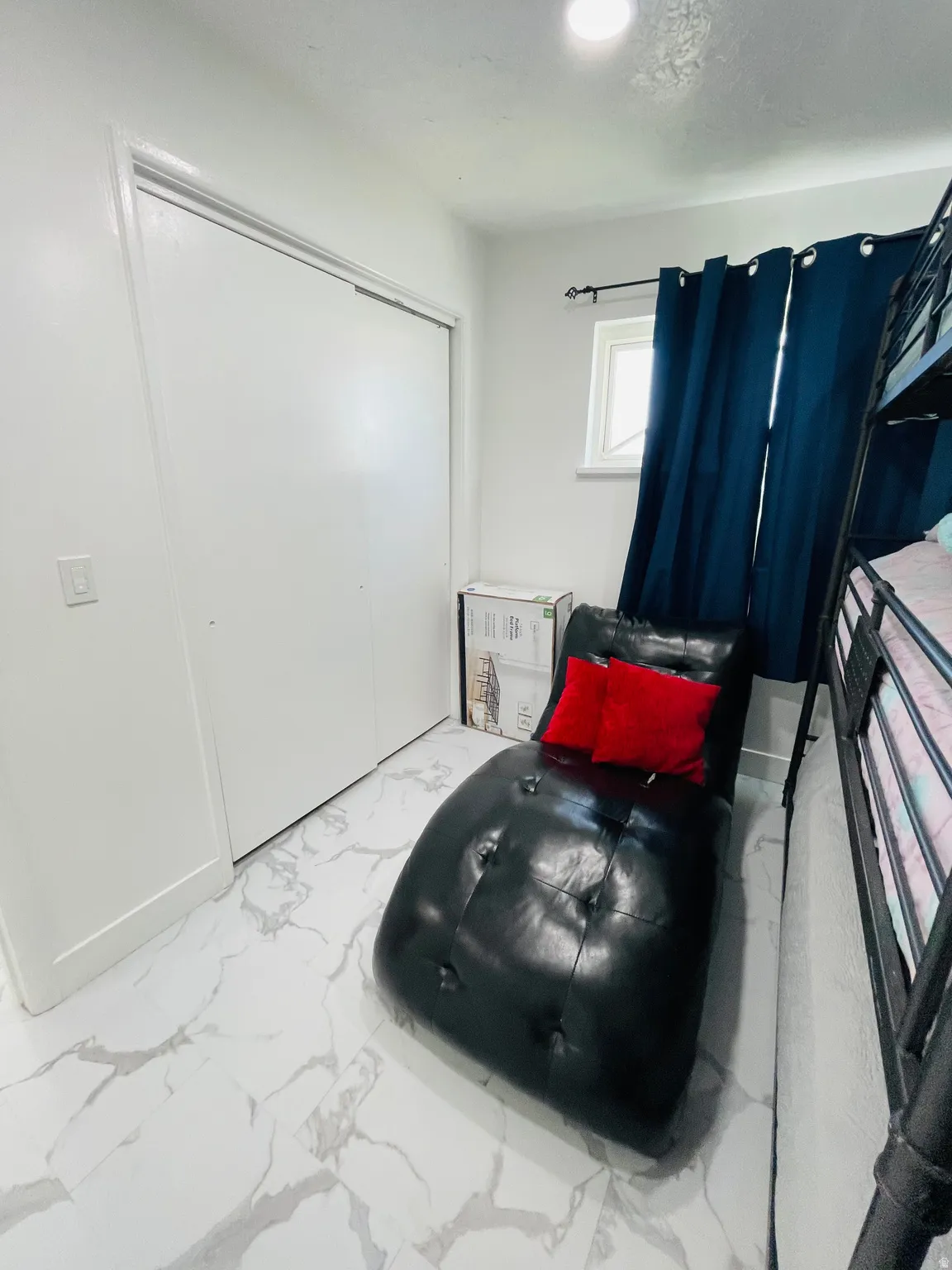 Sitting room with light marble finish floors
