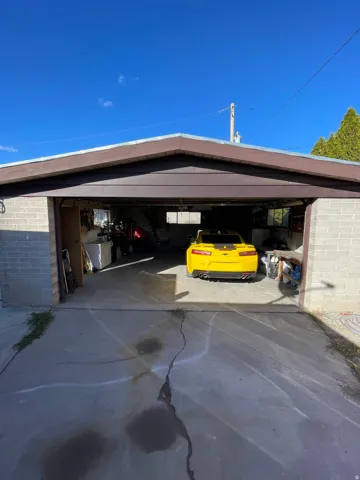 Garage featuring driveway