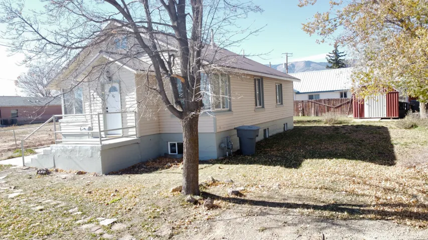 View of home's exterior with a shed