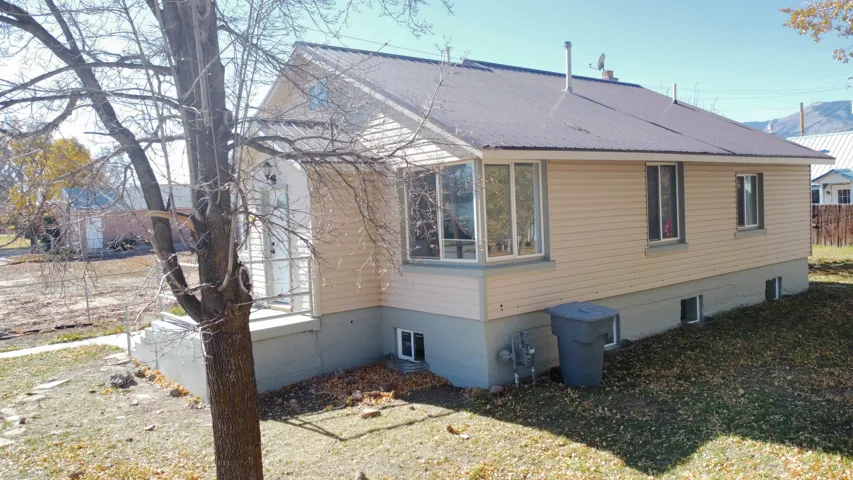 View of property exterior with a metal roof