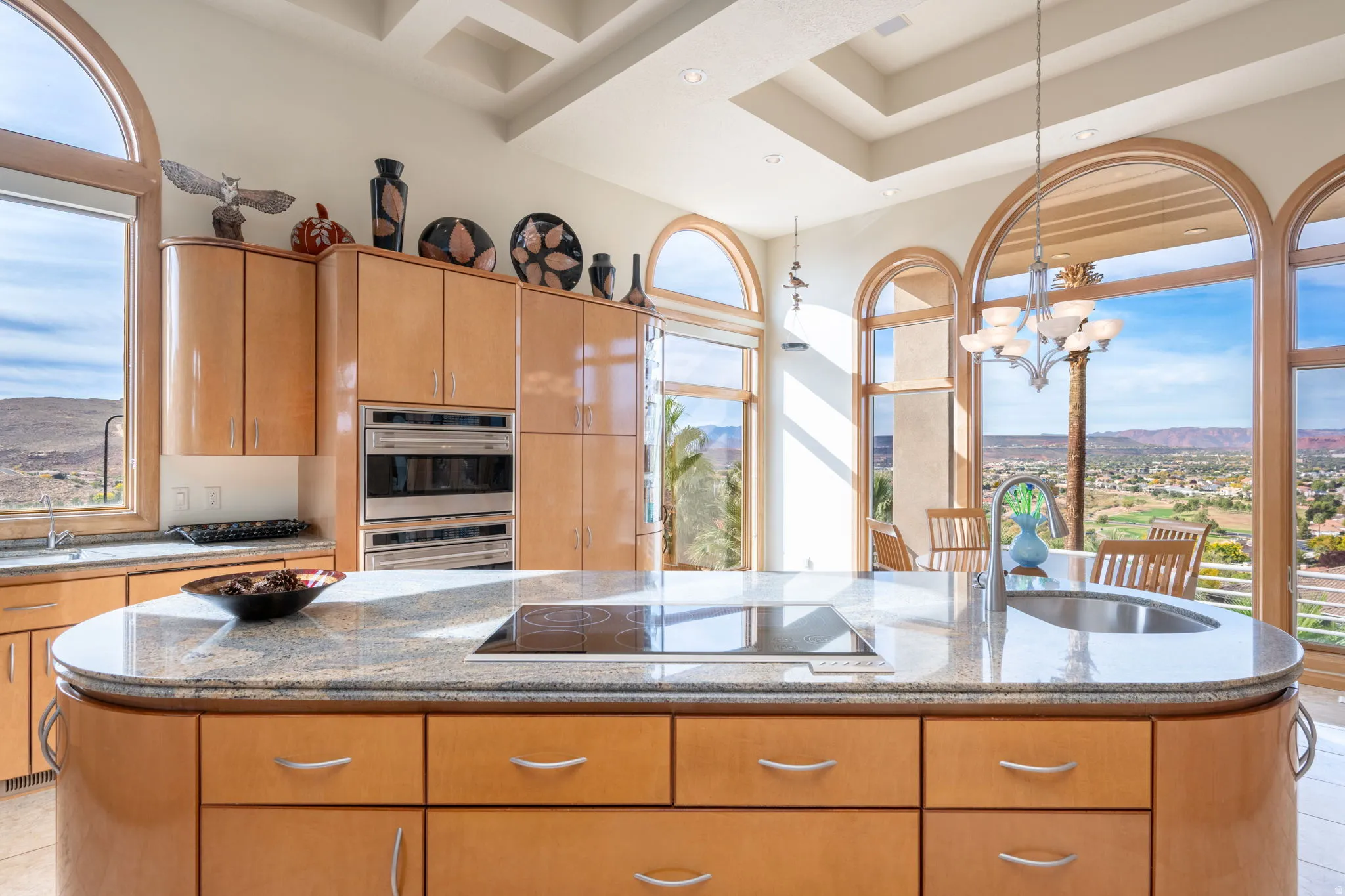 Kitchen with light stone counters and healthy amount of natural light