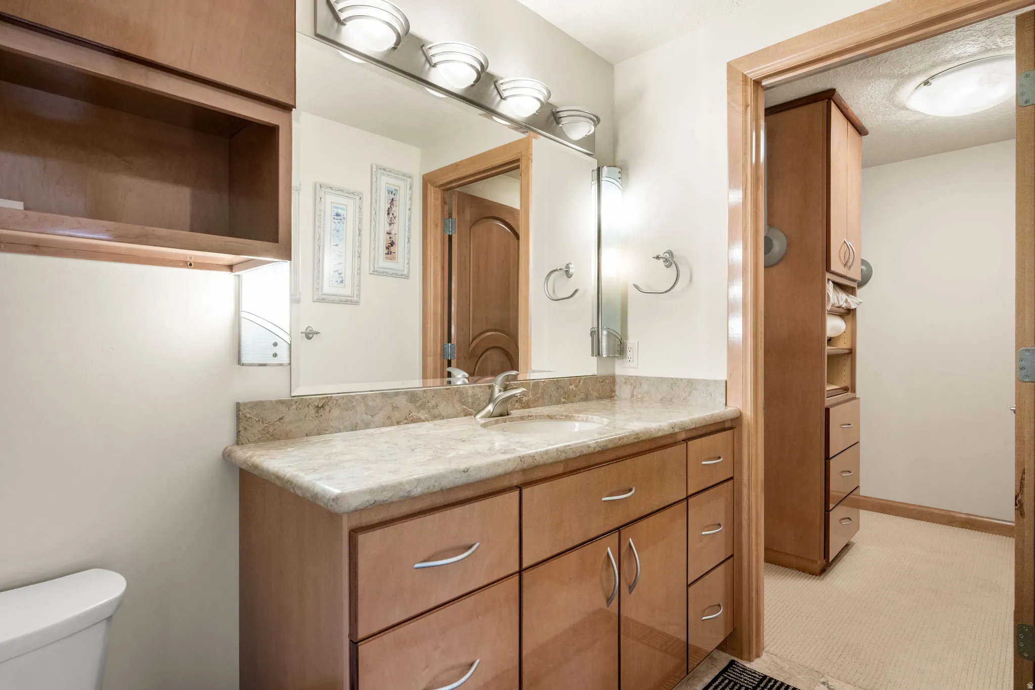 Half bath with vanity and toilet