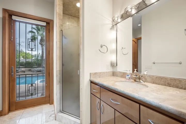Bathroom featuring vanity and a shower stall