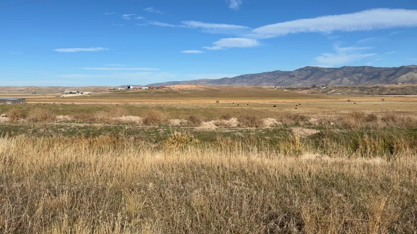 View of mountain backdrop featuring rural landscape