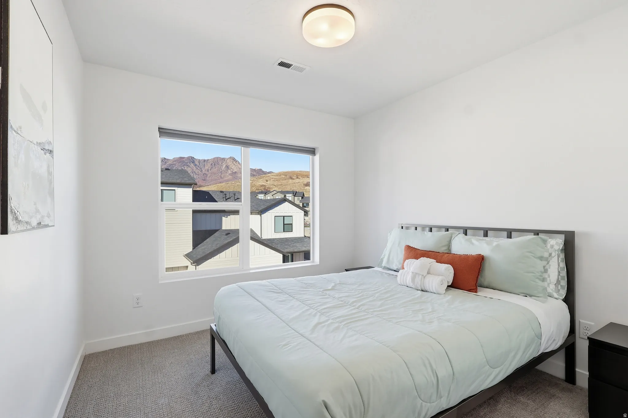 Carpeted bedroom with baseboards