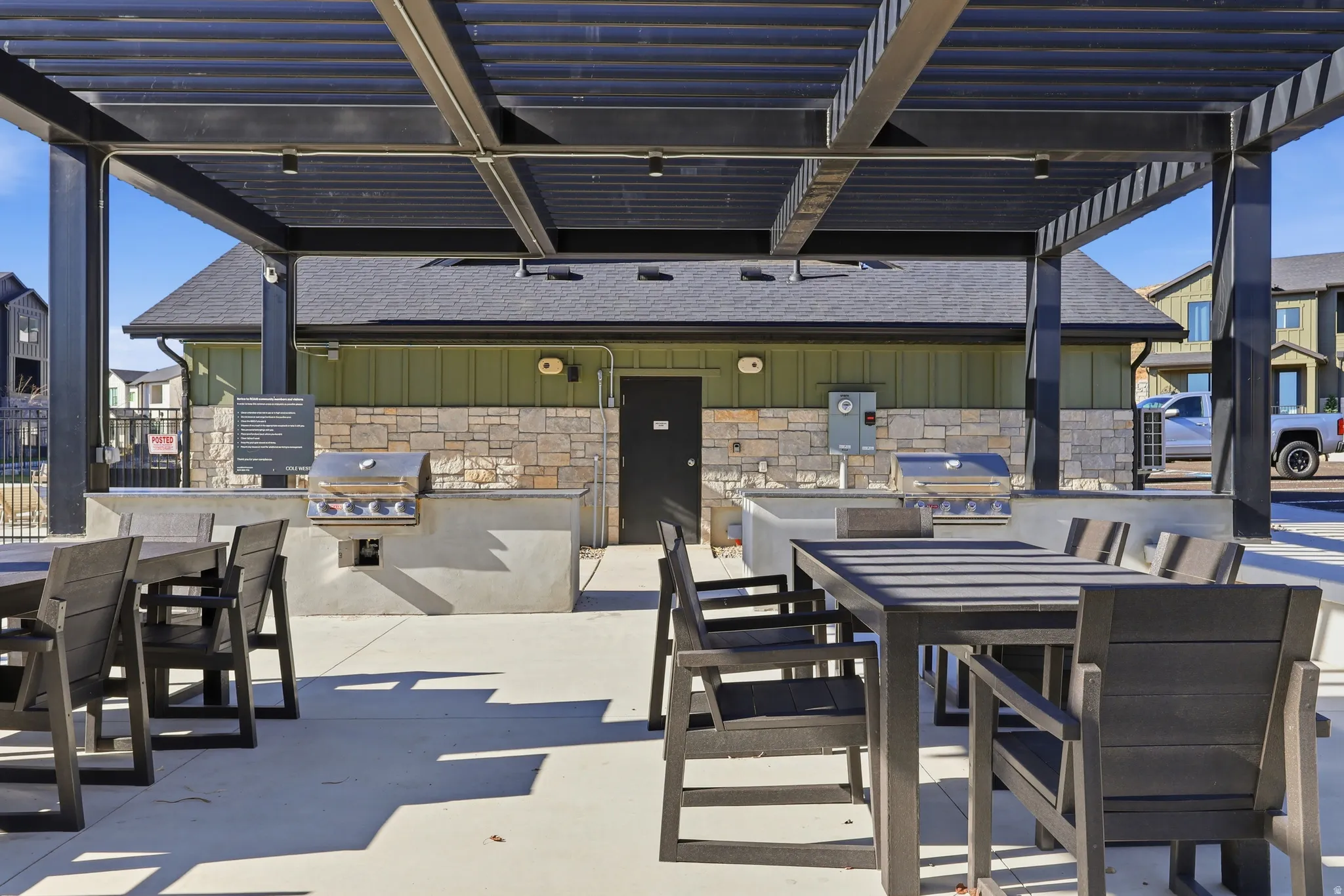 View of patio with outdoor dining space and exterior kitchen