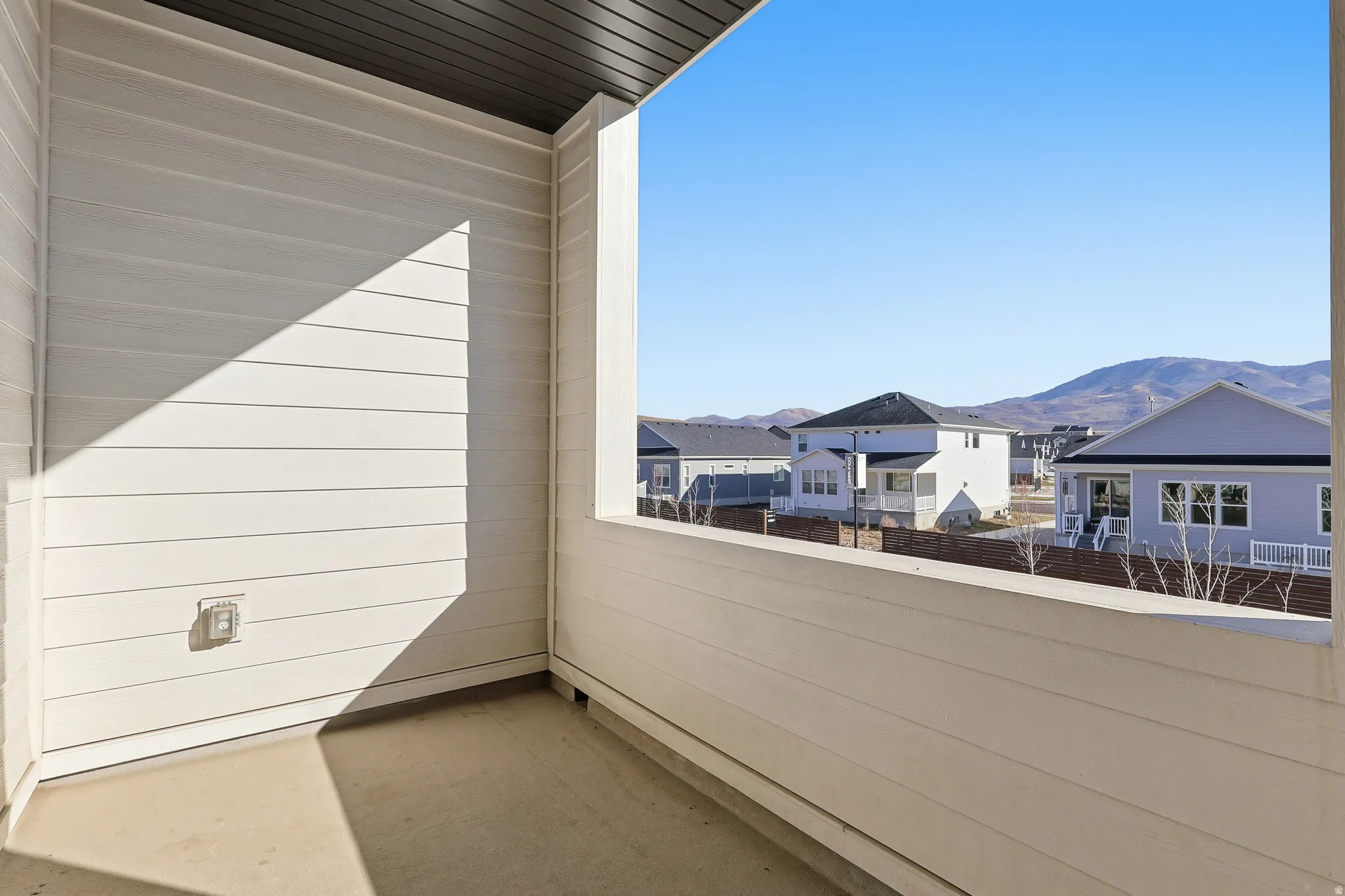 Balcony with a mountain view and a residential view