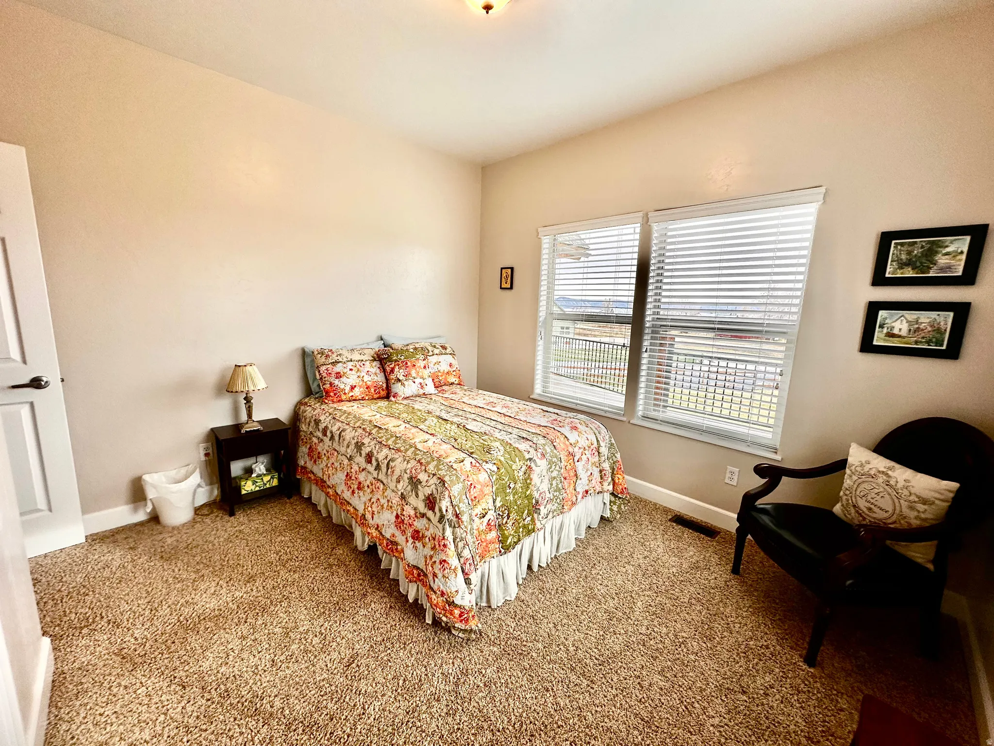 Bedroom featuring carpet floors and baseboards