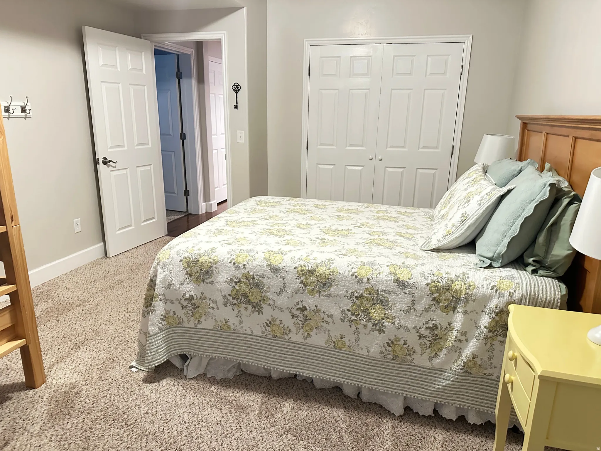 Bedroom featuring carpet and a closet