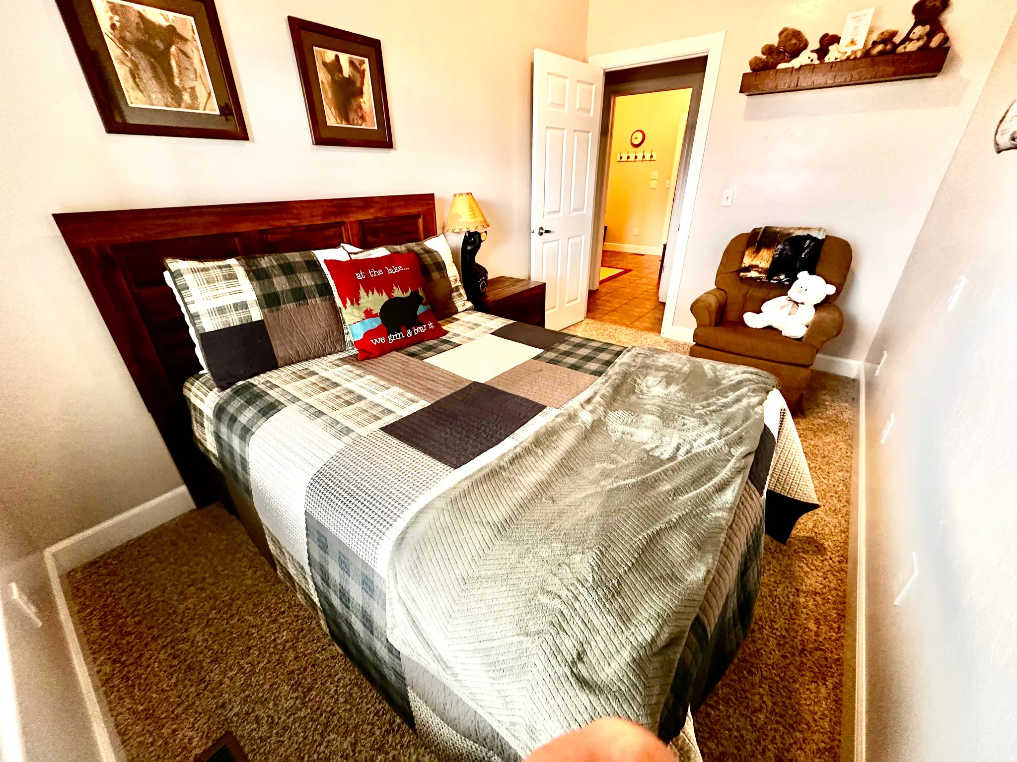 Bedroom featuring light carpet and baseboards