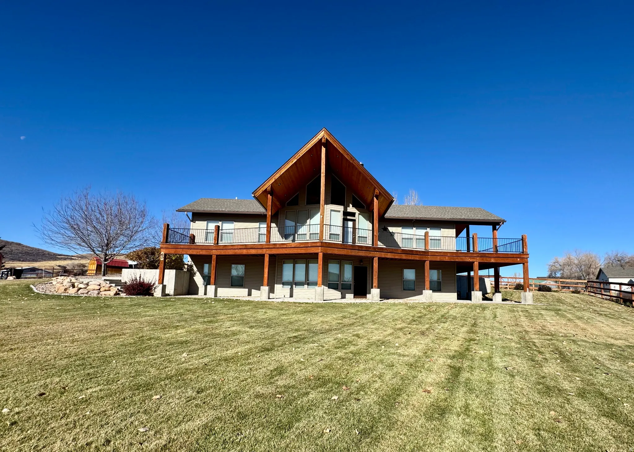 Back of house featuring a patio and a lawn