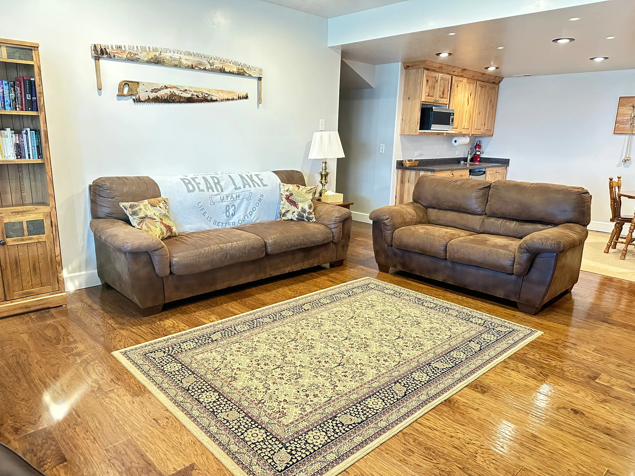 Living room featuring light wood finished floors and recessed lighting