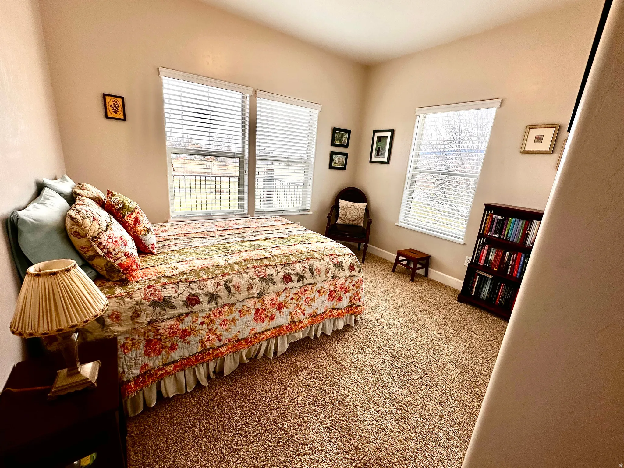 Bedroom with carpet flooring and baseboards
