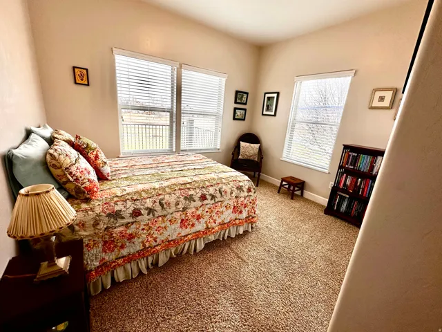Bedroom with carpet flooring and baseboards