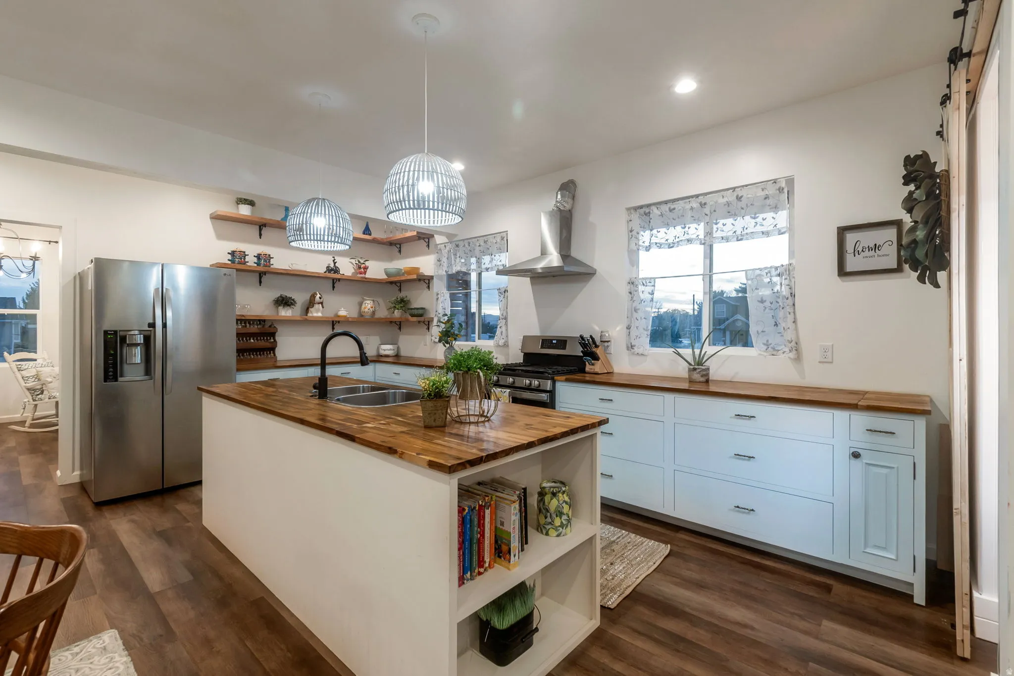 Kitchen with butcher block counters, open shelves