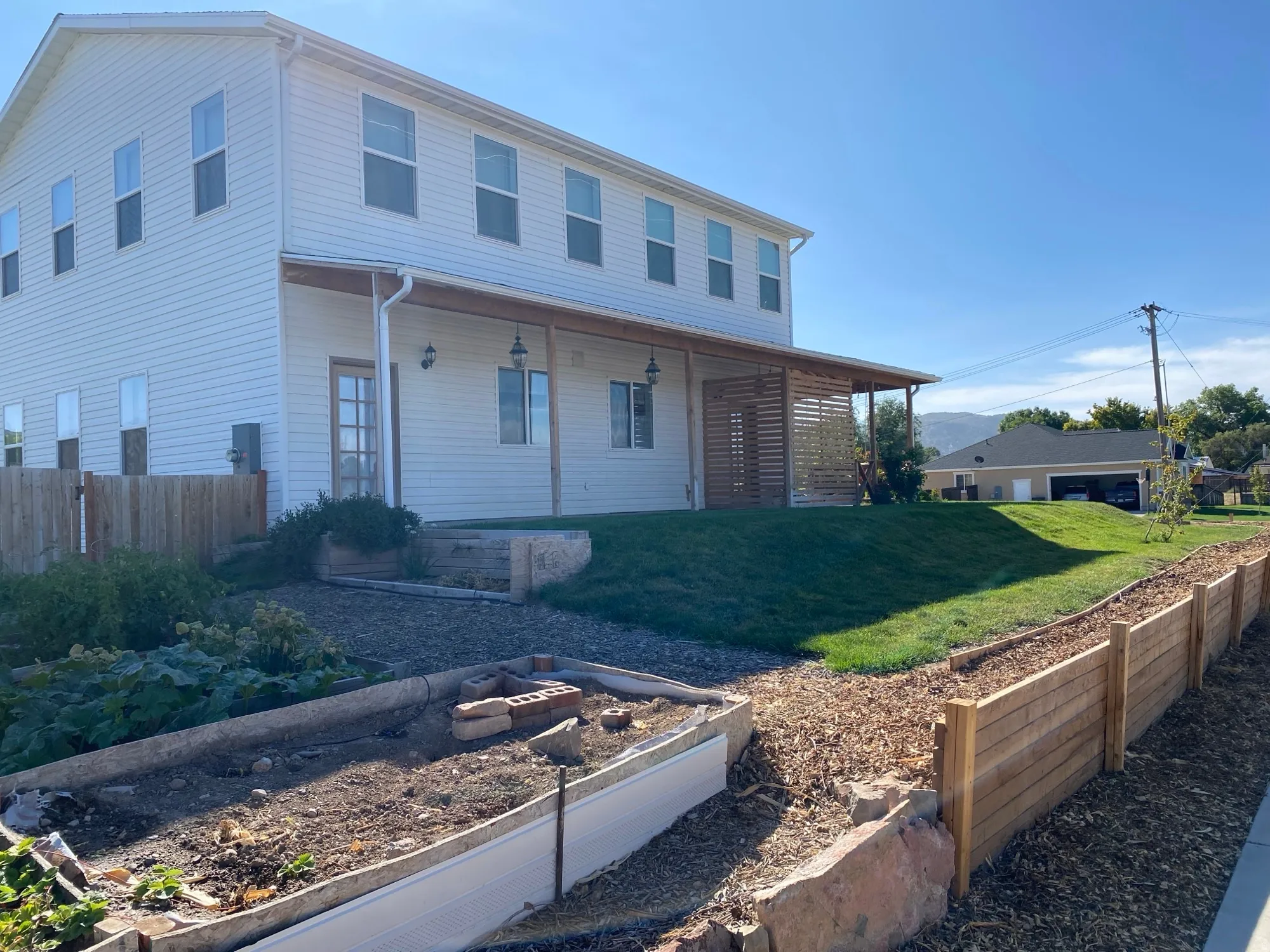 View of front of property with a vegetable garden